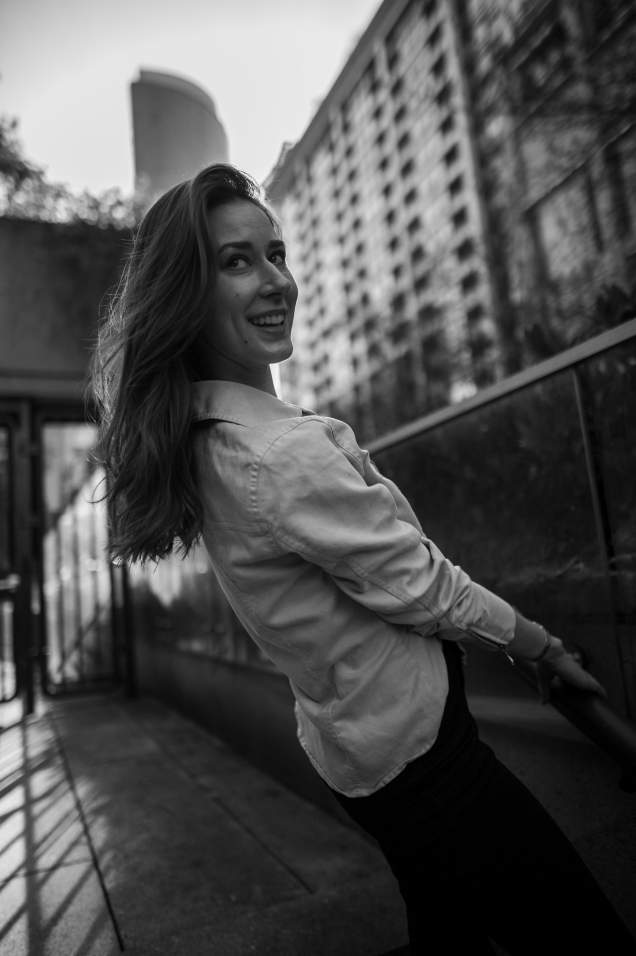 Smiling on the rail — late afternoon light