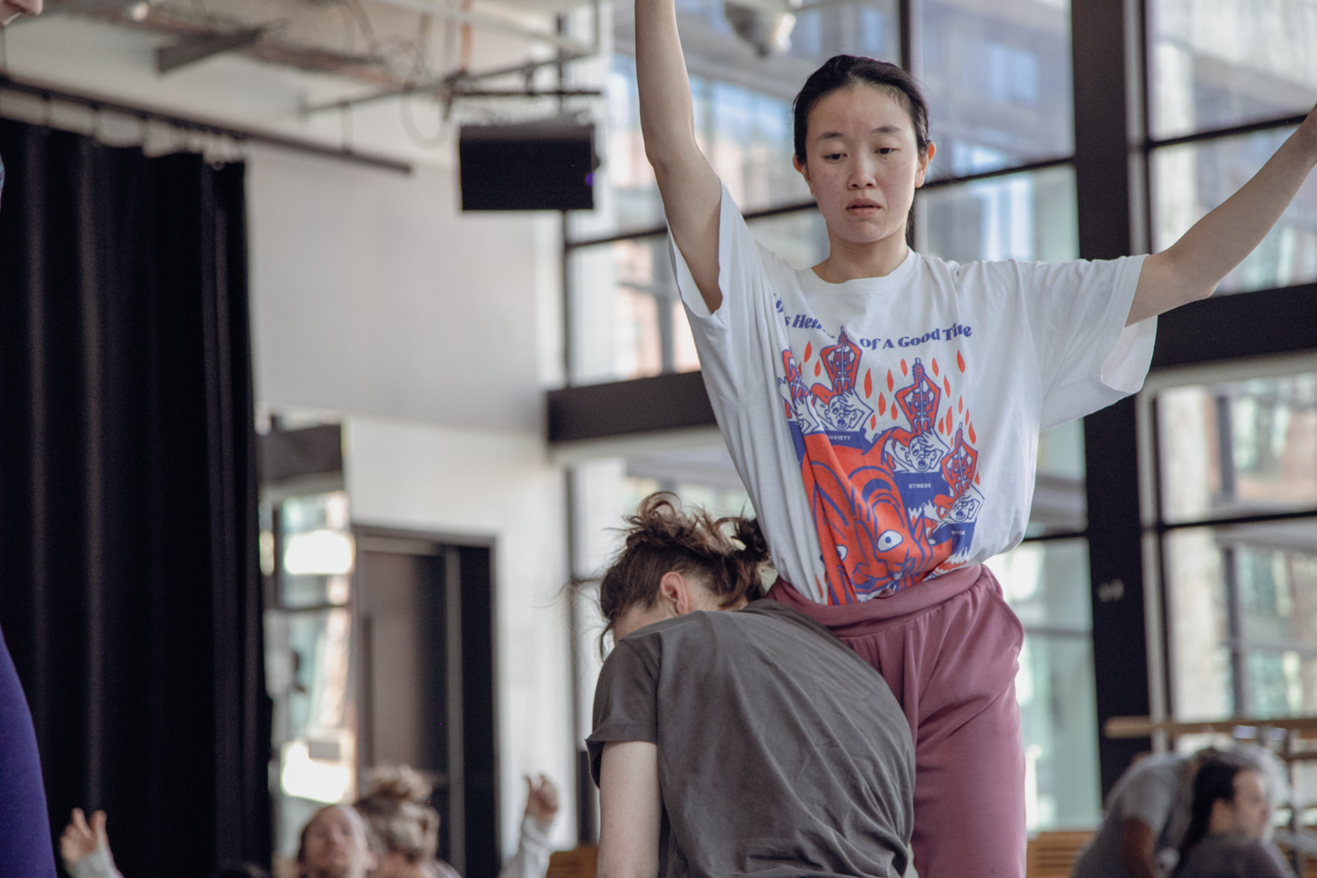 Lift — arms open above a shared base