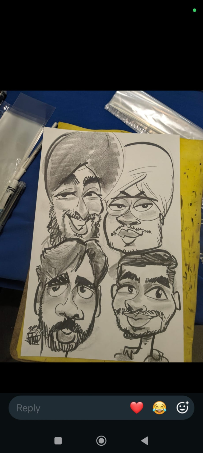 Charcoal group caricature of four friends by Juan