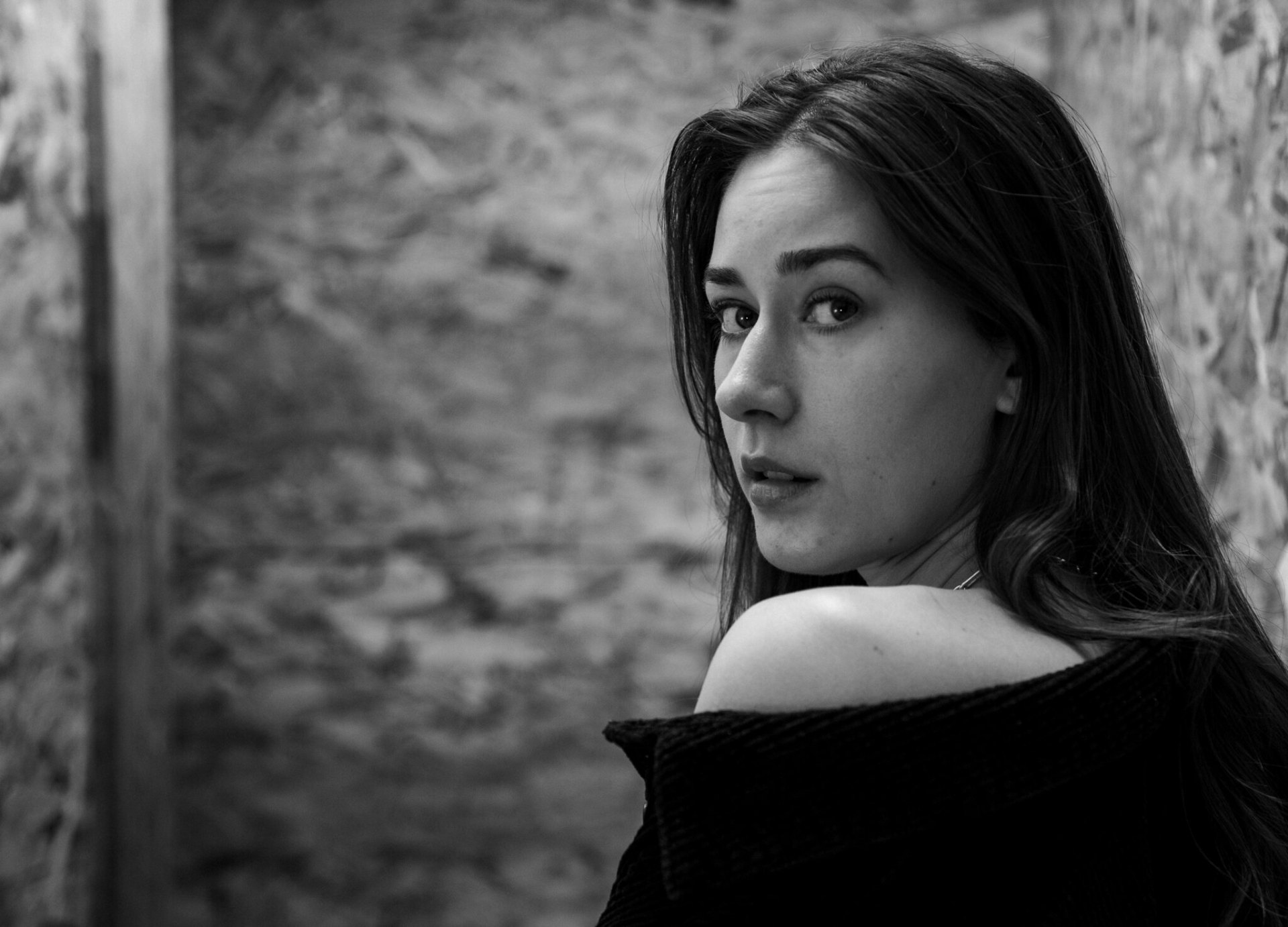 Close portrait — soft window light on stone