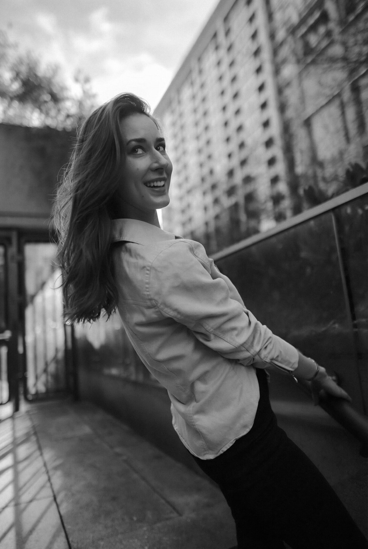 Laughing on the stair rail — golden hour