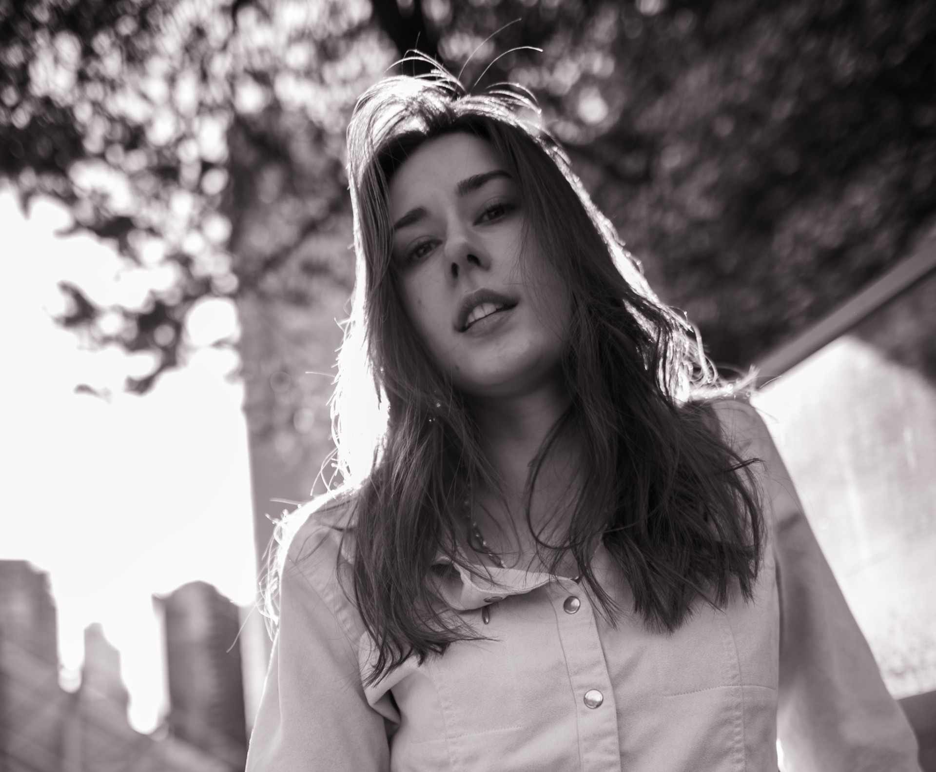 Backlit under the trees — close portrait
