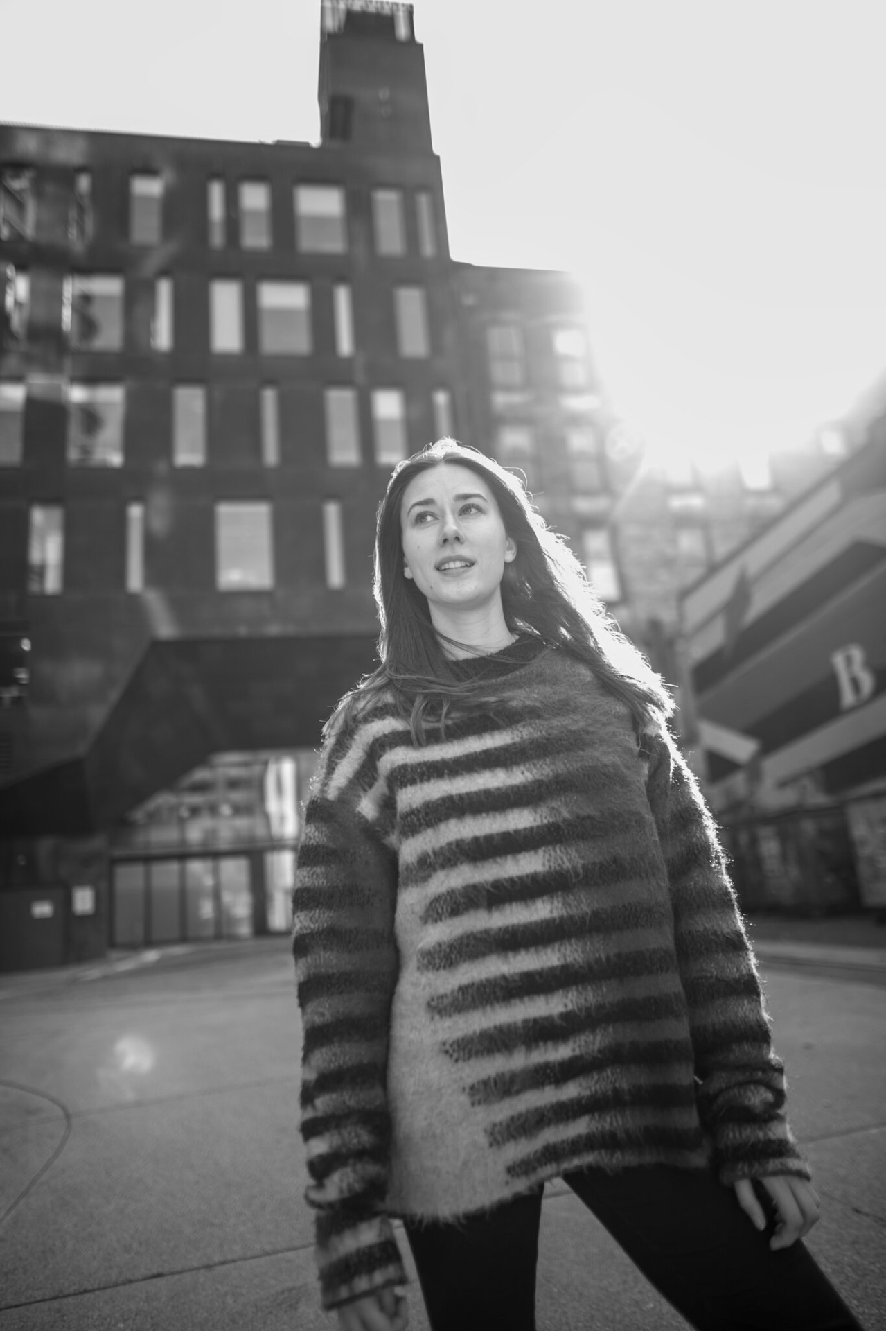 Backlit in the plaza — winter sun flare